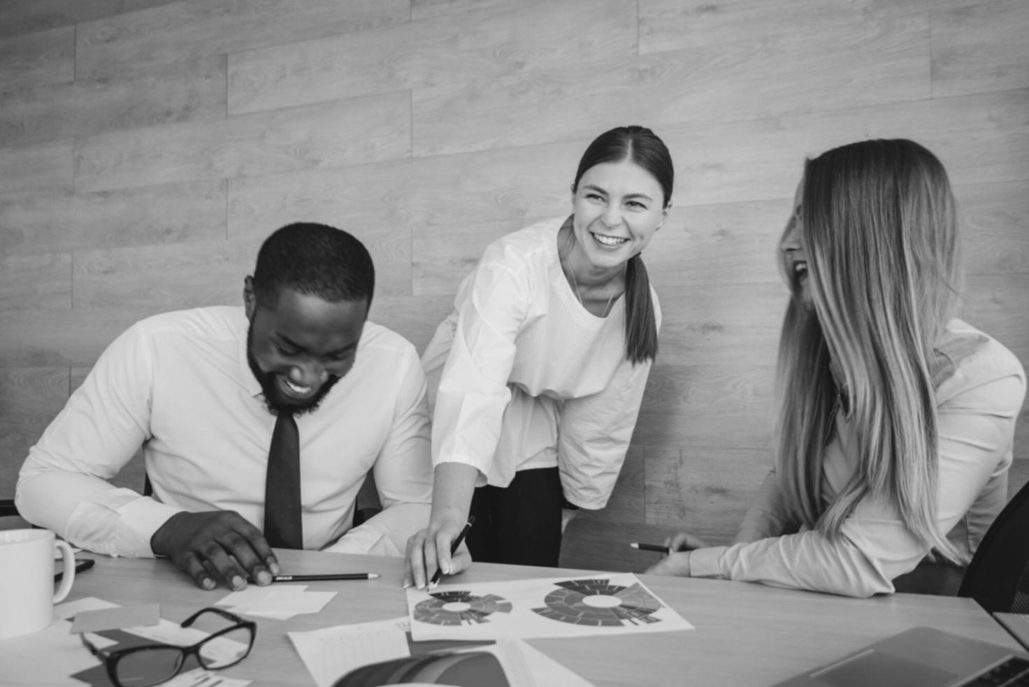 Professional team reviewing financial reports and budget planning documents